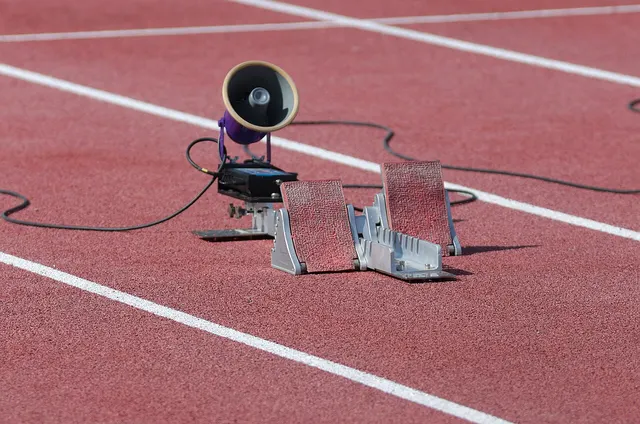 Photograph: Starting blocks with a speaker at a track and field championship.
