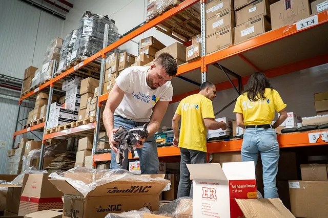 Photograph: Nova Ukraine team preparing humanitarian and medical aid supplies in warehouse for distribution across regions of Ukraine.